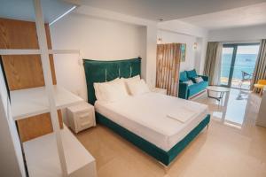 A bed or beds in a room at Ionion Beach Resort