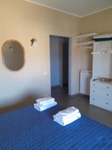 A bed or beds in a room at Le Zagare b&b