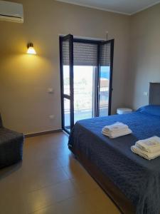 A bed or beds in a room at Le Zagare b&b