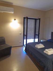 A bed or beds in a room at Le Zagare b&b