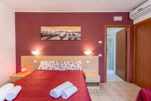 Postel nebo postele na pokoji v ubytování Laguna B&B