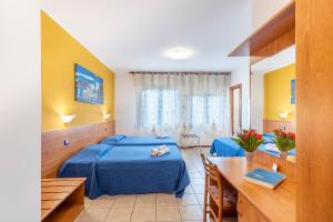 Postel nebo postele na pokoji v ubytování Laguna B&B