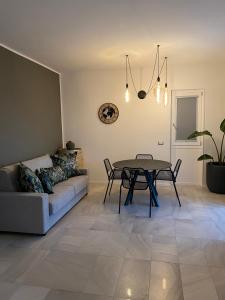 a living room with a couch and a table at La Corte del Sole in Vieste