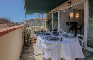 a table on the balcony of a house at Apartments Florence - Florence Magic House in Florence