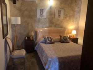 A bed or beds in a room at Villetta Due Palme - vicino GIARDINI NAXOS -