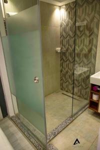 a bathroom with a shower stall and a walk in shower at Elite Pyramids Boutique Hotel in Cairo