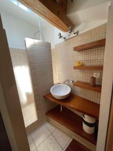 a bathroom with a sink and a mirror at Fenêtre sur Collioure in Collioure +25 photos
