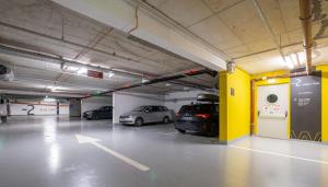 a parking garage with two cars parked in it at Akademis Academia in Dubrovnik +42 photos