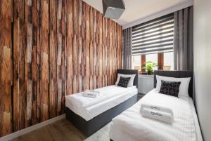 Posteľ alebo postele v izbe v ubytovaní Sun And Ski Jelenia Góra
