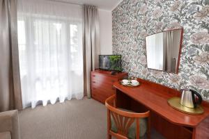 TV a/nebo společenská místnost v ubytování APLEND Hotel Lujza Major