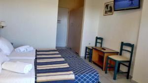 Posteľ alebo postele v izbe v ubytovaní Porto Skala Village Hotel