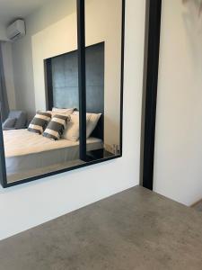 Posteľ alebo postele v izbe v ubytovaní Aellw cozy apartment 1