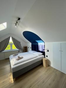 Posteľ alebo postele v izbe v ubytovaní Dubois Apartments Kołobrzeg