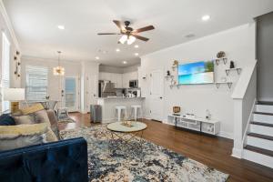 a living room with a couch and a ceiling fan at Luxury San Antonio Home Sleeps 6 in San Antonio