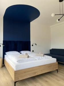 Posteľ alebo postele v izbe v ubytovaní Dubois Apartments Kołobrzeg