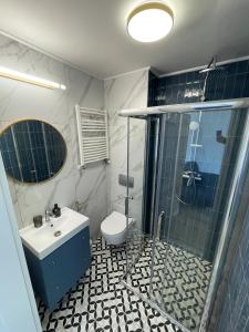 Kúpeľňa v ubytovaní Dubois Apartments Kołobrzeg