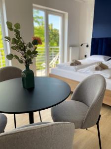 Posteľ alebo postele v izbe v ubytovaní Dubois Apartments Kołobrzeg