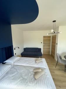 Posteľ alebo postele v izbe v ubytovaní Dubois Apartments Kołobrzeg
