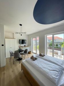 Posteľ alebo postele v izbe v ubytovaní Dubois Apartments Kołobrzeg