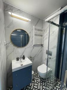 Kúpeľňa v ubytovaní Dubois Apartments Kołobrzeg