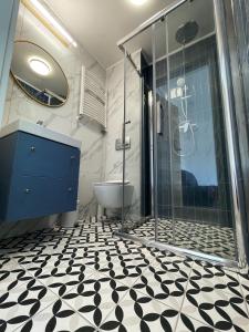 Kúpeľňa v ubytovaní Dubois Apartments Kołobrzeg