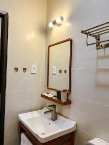 a bathroom with a sink and a mirror at Villa Délight House “Stay&Chill” in Da Lat +37 photos