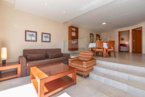 a living room with a couch and a table at Apartamentos Vista Sur in Playa de las Americas