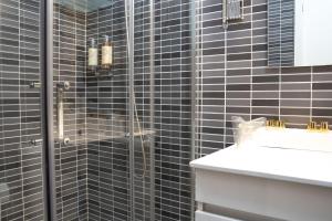 a bathroom with a shower and a sink at Authentic Porto House in Porto