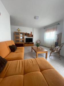 a living room with a couch and a table at Cheyma Home 2ºA, Luminoso apartamento en Alcalá in Alcalá