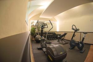 a gym with several exercise bikes in a room at Hotel Convent de Begur in Begur