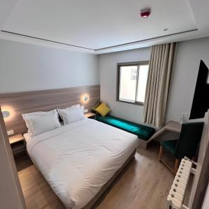 Ліжко або ліжка в номері Fajr Hotel
