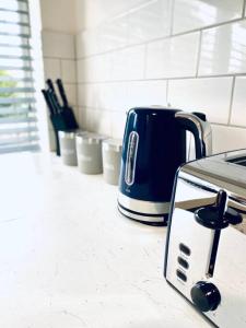 a toaster sitting on a counter in a kitchen at HU-Thirteen Apt Two- Sleeps 4 in Hessle