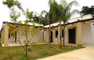a building with trees in front of it at Agriturismo L'Angela in Borgagne