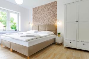 Posteľ alebo postele v izbe v ubytovaní VacationClub – Prusa 2 Apartament 3B + 9 fotografií