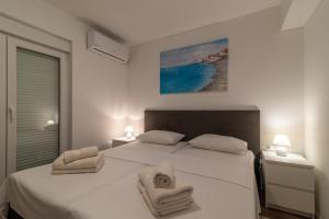 Ένα ή περισσότερα κρεβάτια σε δωμάτιο στο Delux apartment EVA