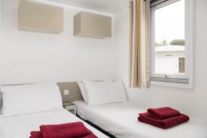 En eller flere senge i et værelse på Camping Ca' Savio + 70 billeder