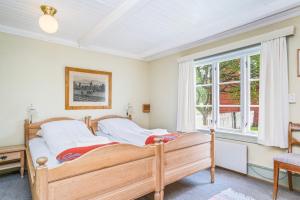 Postel nebo postele na pokoji v ubytování Kongsvold Fjeldstue by Frich`s