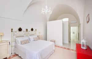 Ένα ή περισσότερα κρεβάτια σε δωμάτιο στο Palazzo Greco - Luxury Apartments with sea-view