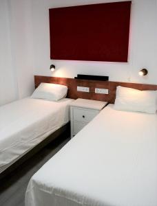 Postel nebo postele na pokoji v ubytování PALMENGARTEN APARTMENT Los Molinos