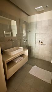 a bathroom with a tub and a sink and a shower at Ferienwohungen Wedl in Kleinarl +23 photos