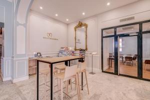 a dining room with a table and chairs at Hôtel Miléade L'Orangeraie - Menton in Menton