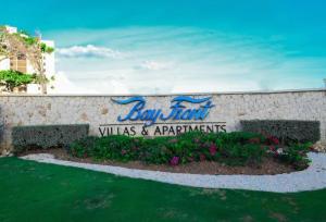 a sign for the bay front villas and apartments at Ornella Villa 2-Beds Sleeps 4 - Pool & Parking in Portmore