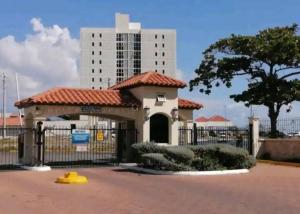 a building with a gate in front of a building at Impeccable 2-Br Apartment-Ornella Villa in Portmore