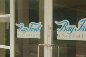 a pair of signs on the door of a bay front apartment at Ornella Villa 2-Beds Sleeps 4 - Pool & Parking in Portmore +36 photos