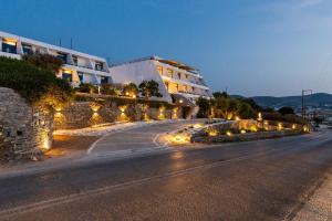 a street with lights on the side of a building at Hippocampus Hotel in Naousa
