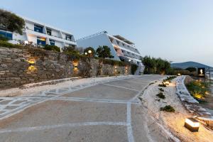 an empty street in front of a building at Hippocampus Hotel in Naousa