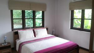 Postel nebo postele na pokoji v ubytování Sunflower Villas + 25 fotografií
