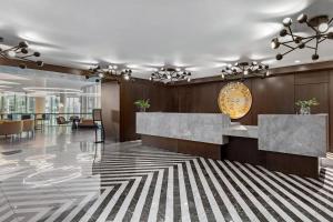 an office with a lobby with a reception desk at Omni Charlotte Hotel in Charlotte +114 photos