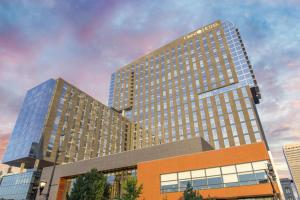 a rendering of a tall building in a city at Omni Louisville Hotel in Louisville