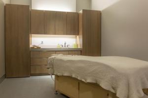 a bedroom with a bed and a sink at Omni Louisville Hotel in Louisville